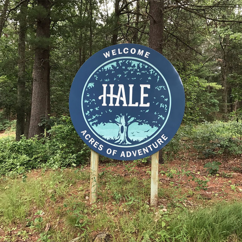 Photo of an outdoor sign that reads 'Welcome Hale Acres of Adventure'